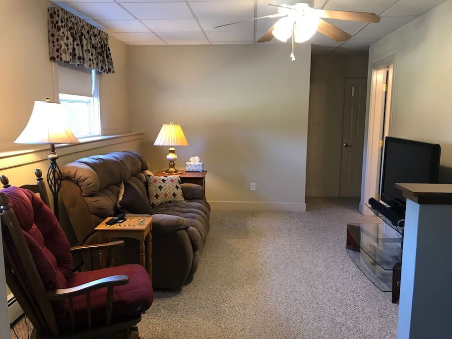 Living room with windows facing out front of house.