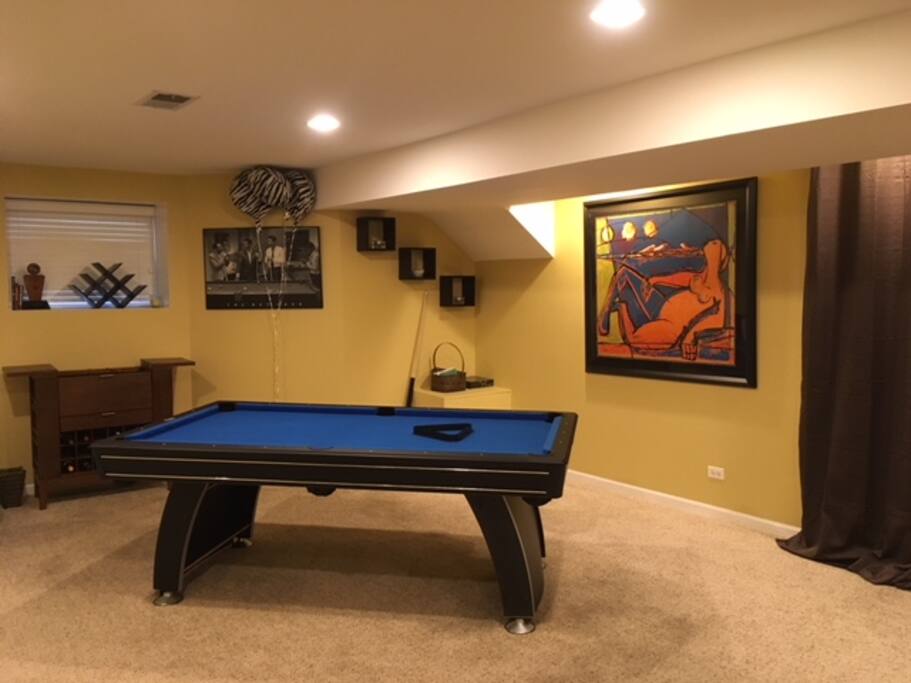 Pool table and small bar area.