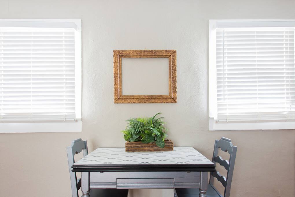The perfect little table serves as a great spot for meals.