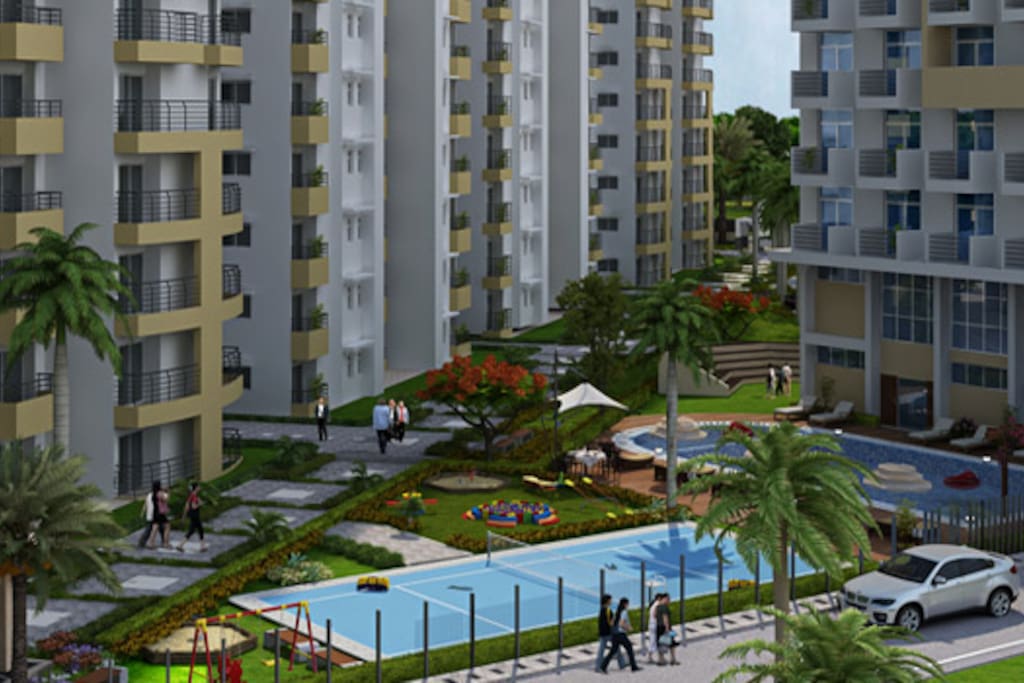 The outlook of the swimming pool and garden at the apartment