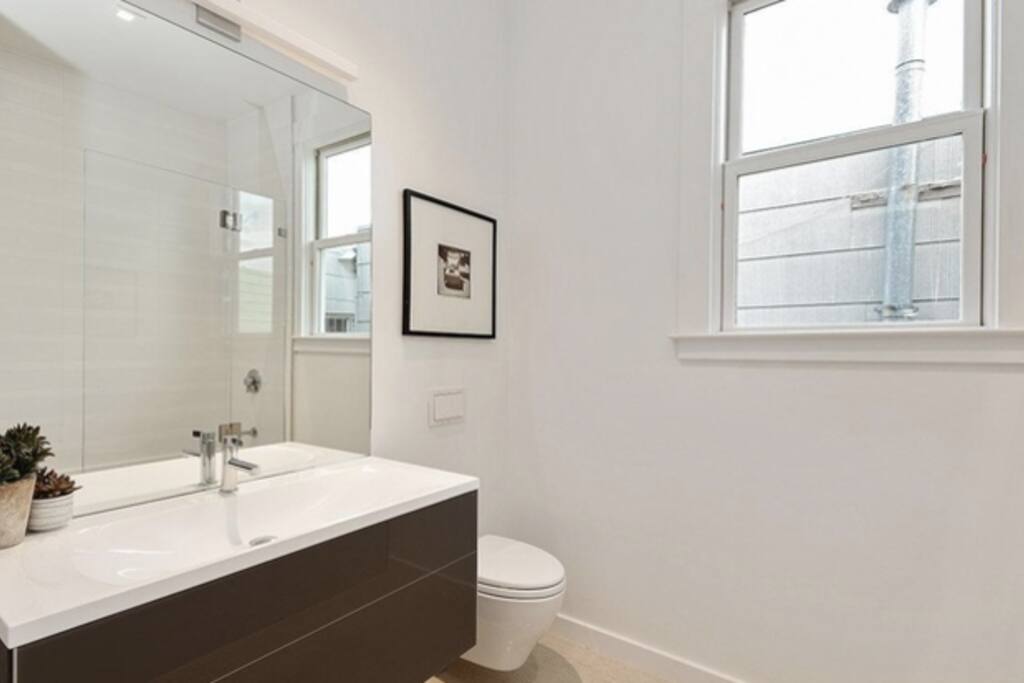 private bathroom with tub and shower
