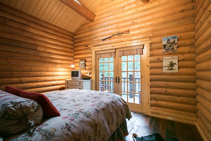 Queen bedroom on second floor with private balcony