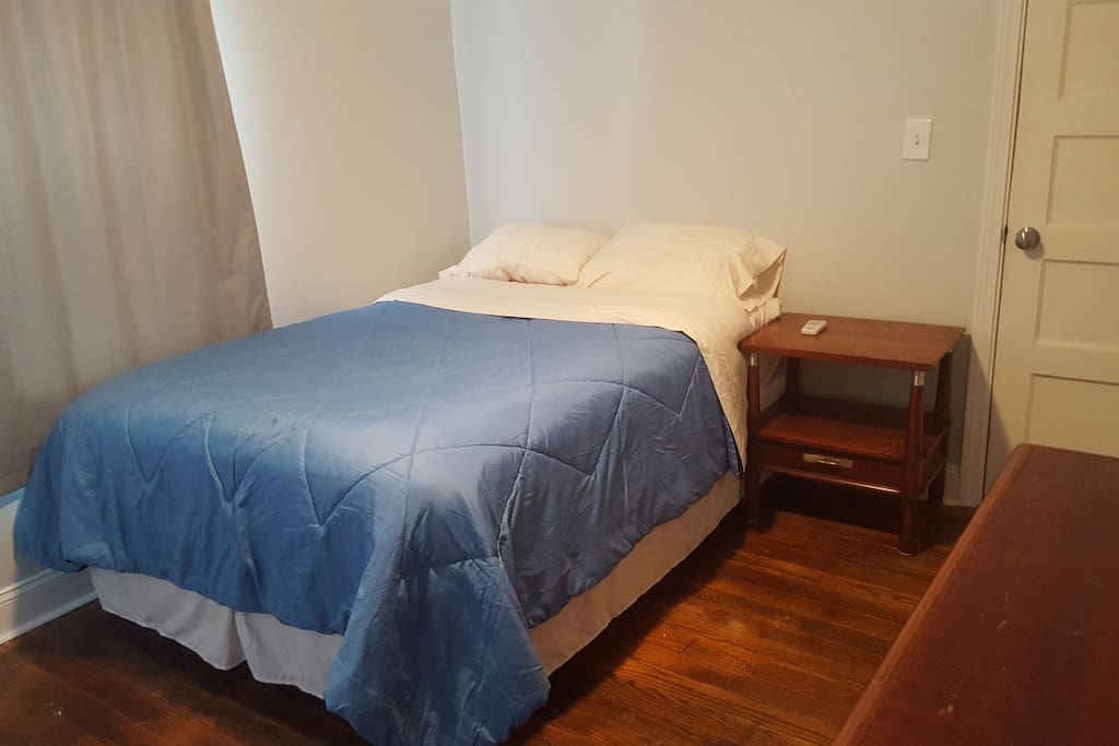guest bedroom with a full size bed