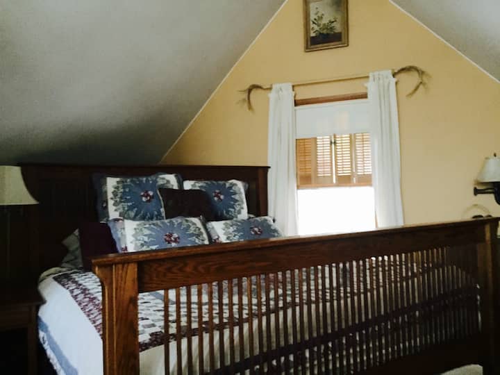 King bed in the upstairs loft bedroom with beautiful views.