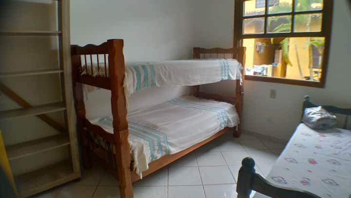 Bedroom 02, a bunk bed and a single bed and a dresser.