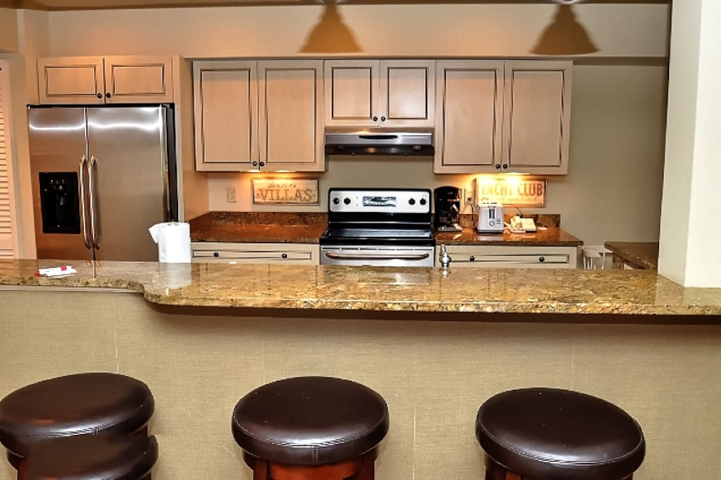 The updated kitchen is open to the living area and dining area.