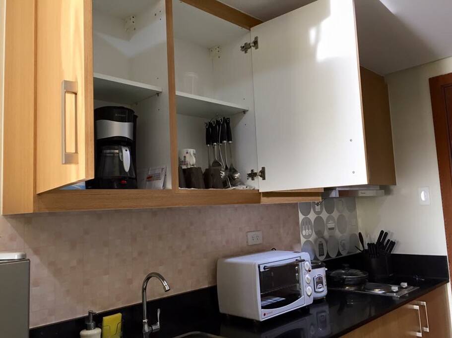 kitchen with complete utensils and cookwares