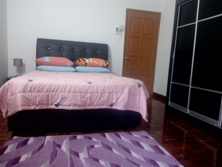 Queen bed with wardrobe.