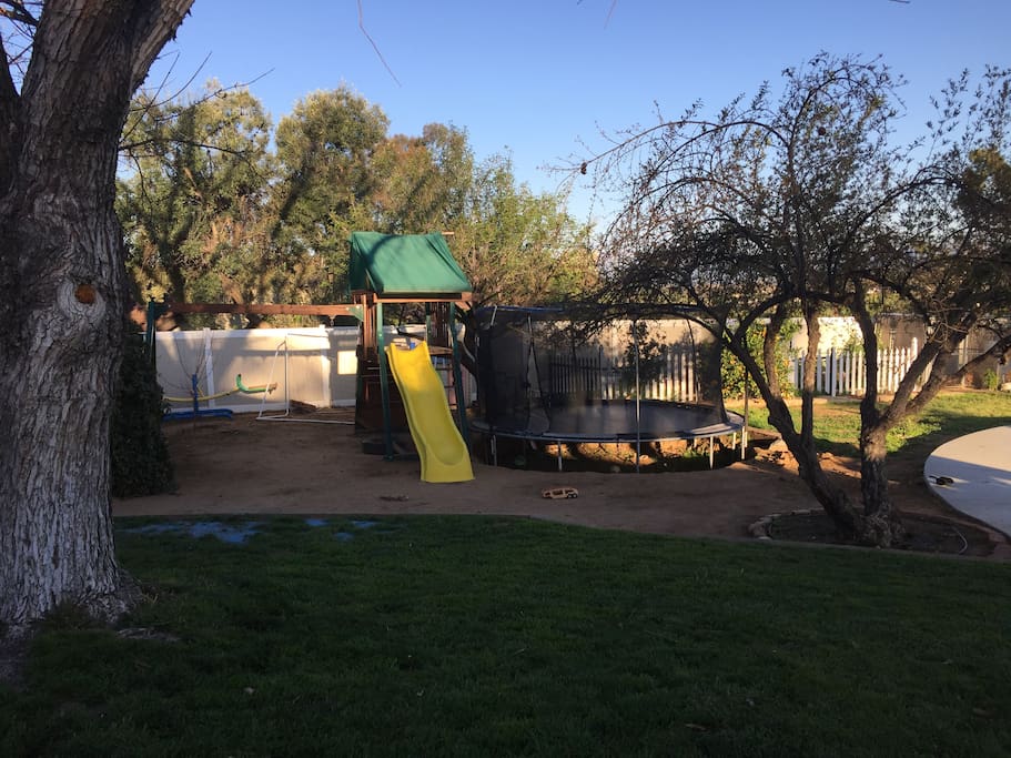 Play set and trampoline.