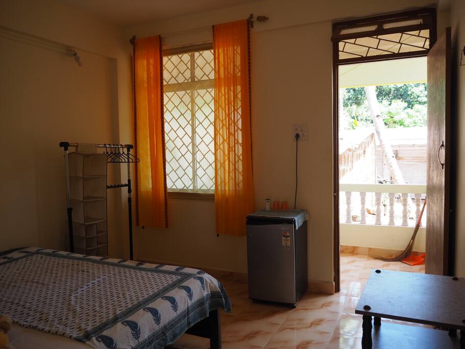 Clothes rail, fridge and table/shelves unit
