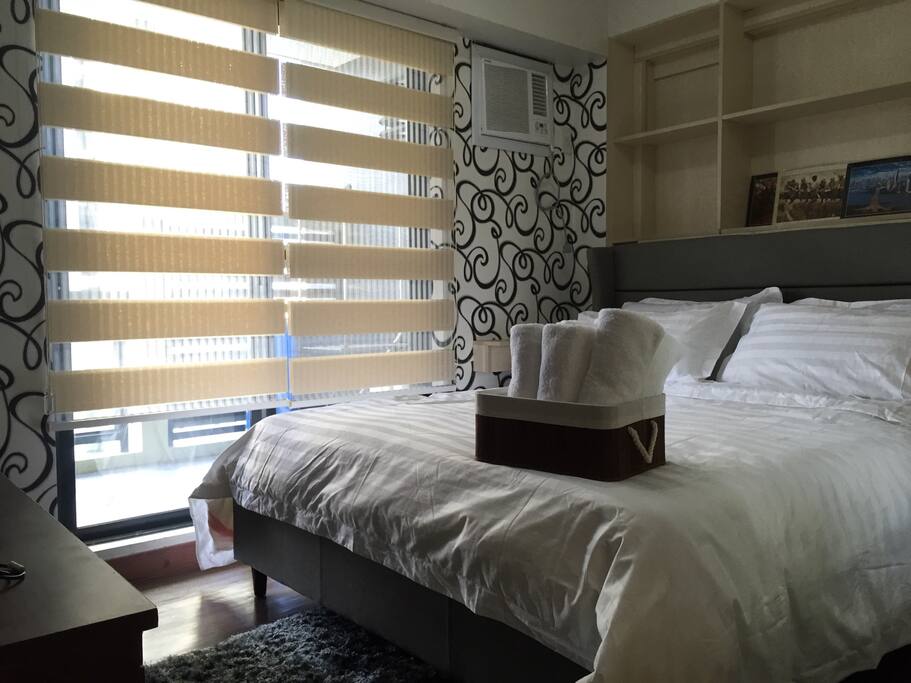 Main bedroom with Queen bed and a wide balcony