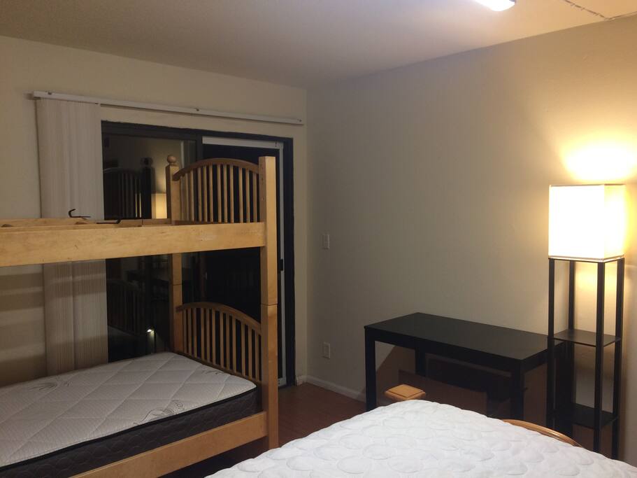 The room has an accessible desk and balcony, with chairs and table outside