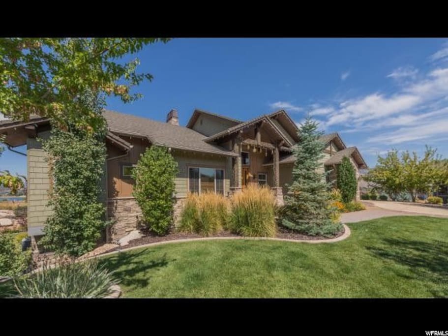 Beautiful landscaping with privacy trees and holiday lights