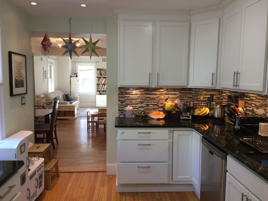 A view from our kitchen and back entry looking through the rest of the first floor (dining room and living room)