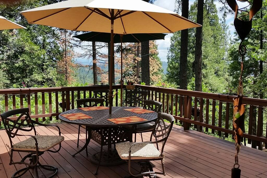 Large wood deck with plenty of outdoor seating. Beautiful, sweeping views of the surrounding hills.