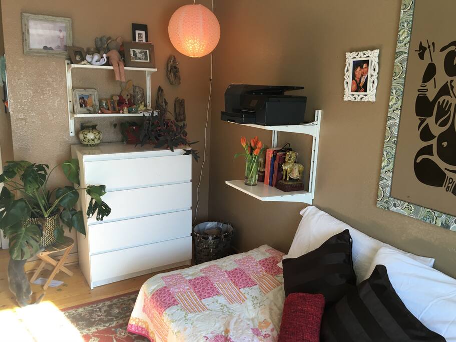 A dresser for my guest to unpack and feel at home and fresh flowers for inviting, welcoming stay