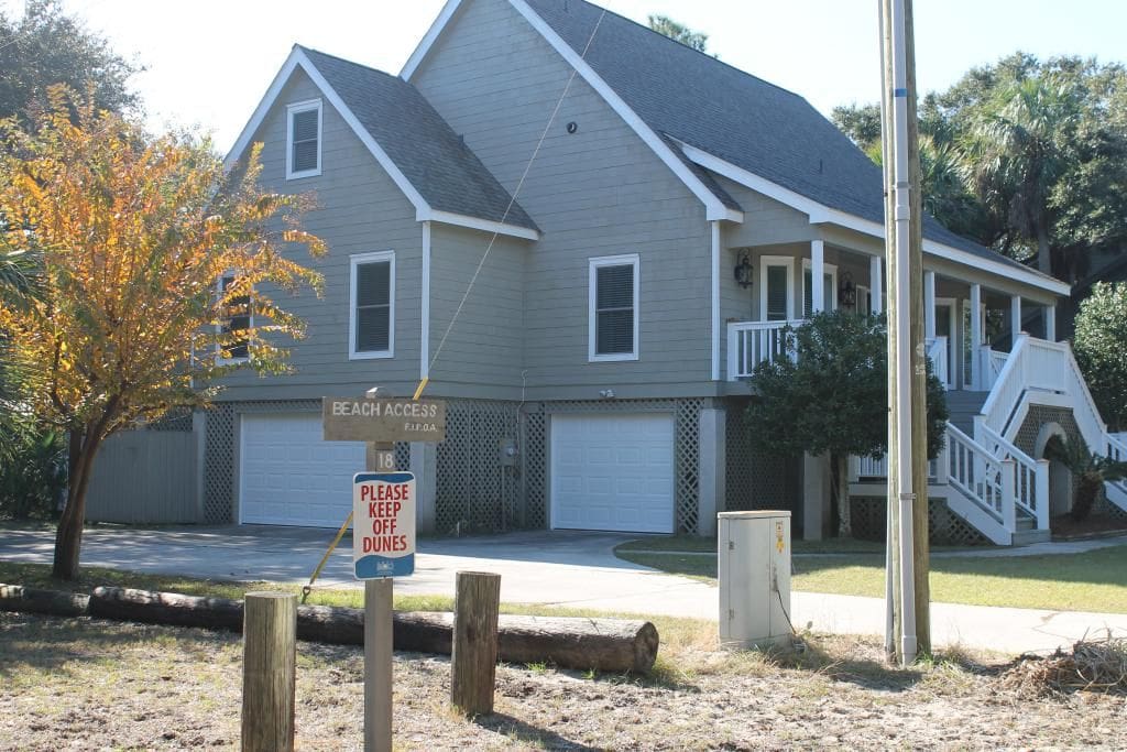 The house is on Beach Access #18, you can't get any closer with a golf cart. The driveway ends at the walkway to the boardwalk.