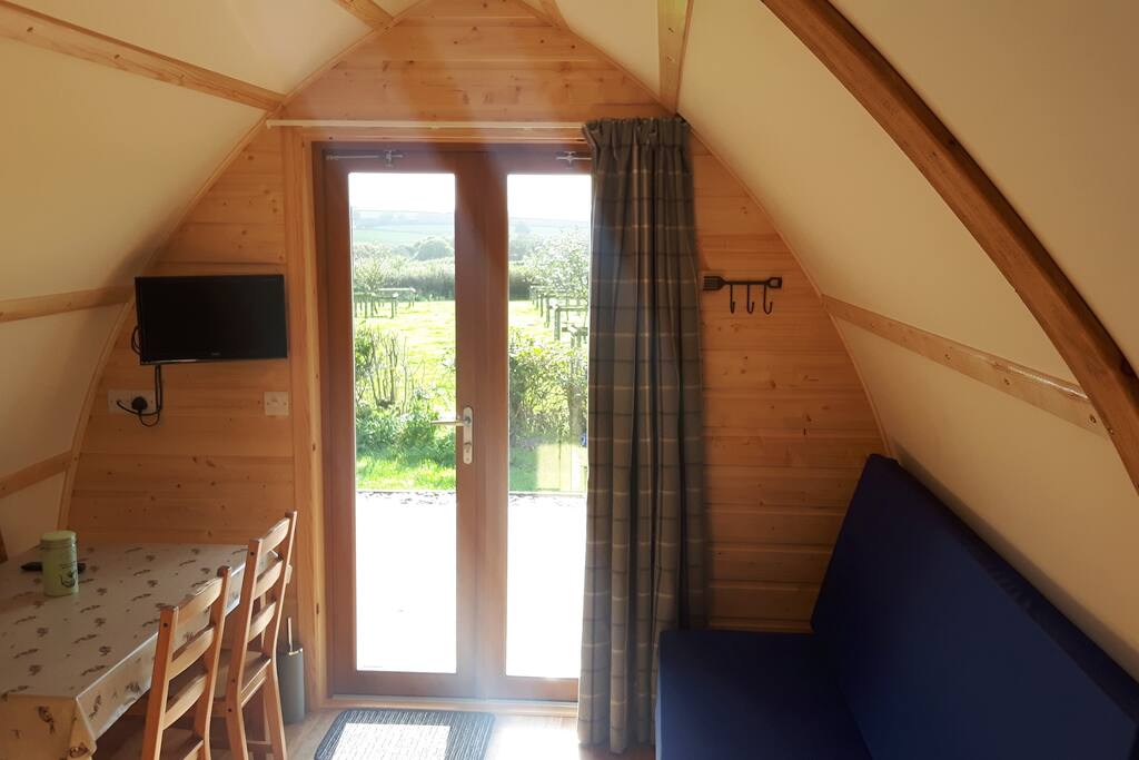 TV and dining table. Plus views over are traditionally Country orchard.