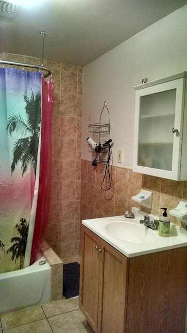 Larger bathroom with shower ( smaller half bathroom without shower not shown) hairdryer, washcloths available to use!