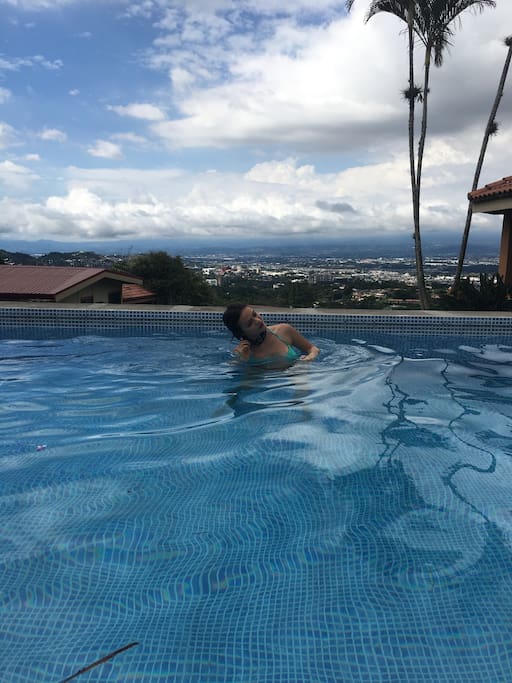 Escazú is a popular area where many North Americans, Costa Ricans and other foreigners live.
Escazú is sometimes called the “Beverly Hills of Costa Rica” because of its upscale ambience. The town is located about five miles west of San José, 10 to 15 minutes driving time on the old two-lane road or newly revamped highway. Most of this suburb is located on hilly terrain, so it is especially appealing to those people who like cooler temperatures. Escazú is one of the most popular places for English-speaking foreigners to live. An American who lives there said, “Escazú is an odd modern mixture of micro niches and little islands of green, stitched together by pot-holed roads and pocked with condo complexes, great mansions behind big gates and small barrios where the wash bakes in the noonday sun.” The town has beautiful century old churches, farmers on oxcarts, many strip malls old adobe houses, one of the country’s most modern hospitals (CIMA hospital), a huge shopping mall (Multiplaza) and countless bars and restaurants.
Old Escazú has some of its quaint traditional feel, despite the condominiums and strip malls going up all around it. In some places adobe buildings still line the narrow roads, and the whitewashed church, the park, and the soccer field still dominate the center of town. Farmers can be seen riding their horses up the streets to and from their farms, a reminder that not everything in Escazú has been quick to change.
Despite having neighborhoods that are still quaint and country-like, Escazú has all the amenities of any North American suburb with U.S. style-living including the best shopping and dining in Costa Rica. Parts of of the town resemble America so much that you may have to blink twice to make sure you are not back in the U.S.
The most commercial part is San Rafael or the lower section. The old main street is now called the “Golden Mile”, a four-lane road jammed with traffic where fast food restaurants and pricey clubs and cafés line both sides of the street (anything from typical Costa Rican places to Tony Roma’s and TGIF Friday’s). In Escazú you can find just about anything including: mini strip malls with clothing stores, English-speaking private schools, pharmacies, a Walmart megastore, trendy shops with name-brand clothing, upscale beauty salons, doctors and dentists, private mail services and more. The neighborhood of San Rafael has a good choice of condos for sale. If you are looking at luxury homes for sale, you might find it right here as there are a lot of them hidden away in areas like Trejos Montealegre.
One advantage to living in Escazú is that you are near Hospital Cima, one of the country’s two best private medical facilities. The country’s largest shopping complex is Multiplaza Escazú, a shopping mall full of U.S.- and European-brand chain stores, several restaurants, a multiscreen movie theater and an Automercado supermarket (the top-end supermarket). Several large furniture and interior stores, PriceSmart and Office Depot, the Real Intercontinental Hotel, and the Plaza Roble office complex can be found in the same area. On the north side of the highway, there is trendy dining for the Costa Rican yuppie set and even one of Costa Rica’s three Hooters restaurants. Avenida Ezcazú, next to Cima Hospital, is Costa Rica’s version of Rodeo Drive. It features a Marriott Courtyard hotel, buildings that house different businesses on the ground floor with offices on upper floors, a state-of-the-art movie theater, upscale restaurants, a multitude of brand name designer stores and Costa Rica’s first Starbucks.
San Antonio de Escazú, which is up in the hills is more affordable for expats and is the quiet area of Escazu. It’s located higher up on the mountain, but it’s only a couple of minutes from the rest of Escazú. This area is not as developed as the other parts of Escazú and is a mixture of the rural with the city.
Some parts of Esacazú are eclectic where you’ll find mansions with shacks as their neighbors. Most condos in Escazú are located in different areas. You can find pretty almost anything in Escazú, from low-, mid-, and high-rise condominiums to houses in gated communities to traditional tico-style houses up in the hills. A few lots are still available as well, though not many, and they’re very pricey. At night hillside homes have fantastic panoramic views of the twinkling lights of the Central Valley.
Guachipelín or Guachi, as the locals call it, is the newest and most modern part of Escazú. In addition to the strip malls, hotels, the huge MultiPlaza shopping mall, Cima hospital, PriceSmart (Costco in U.S.), supermarket and many other businesses, there are also many residential areas offering new homes starting at the $100,000 all the way up to the $1,000,000 million price range.
If you like a large selection of restaurants, many activities to stay busy like yoga and gyms, good shopping and Costa Rica’s version of Miami, then Escazú might just be the place for you.