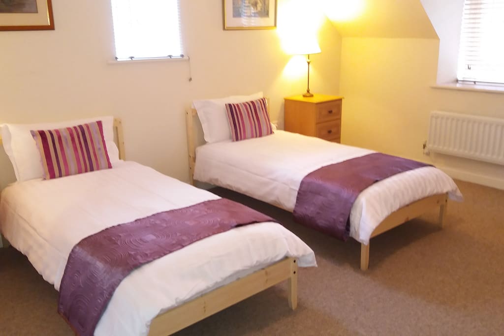 Main bedroom with twin beds, these can be moved together if wished. En suite Bathroom.