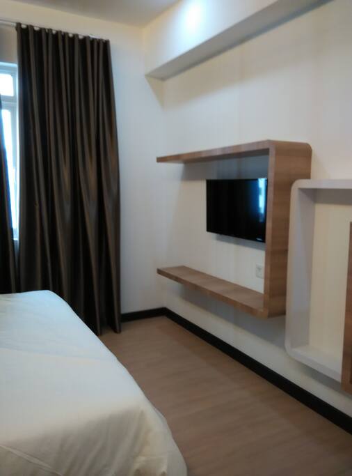 Master bedroom with TV set