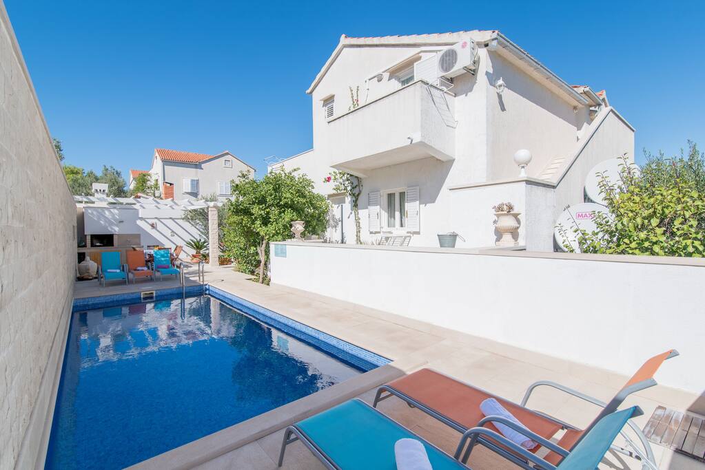 Lovely pool area with sunbeds