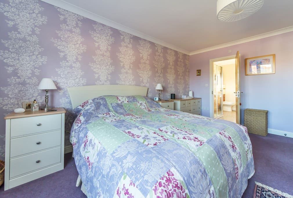 Saffron bedroom with door to ensuite.