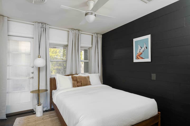 This cute room features queen sized bed, door to the gated front yard, and large walk-in closet space.