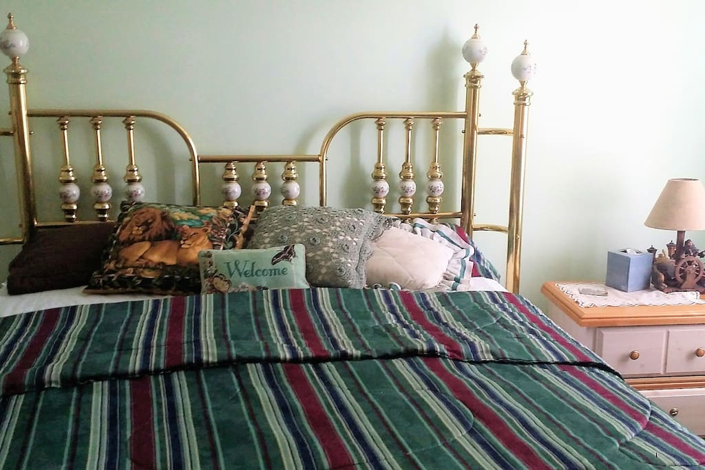 You can stay in the green room with a 4 poster Brass bed.