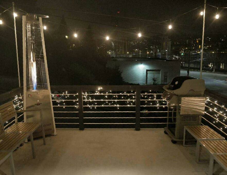 Well-lit patio with natural gas plumbed grill & heater is ready for you to enjoy a nice territorial view of Queen Anne. Bench converts to a Bistro Table for two.