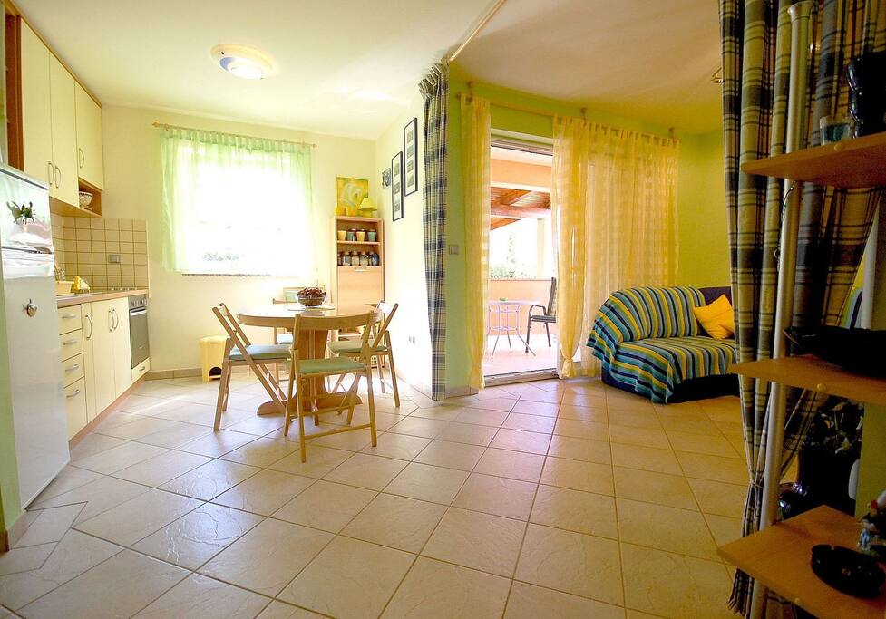 Kitchen with dining area and living room