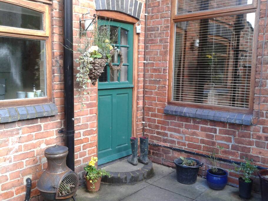 Rear patio area and main entrance