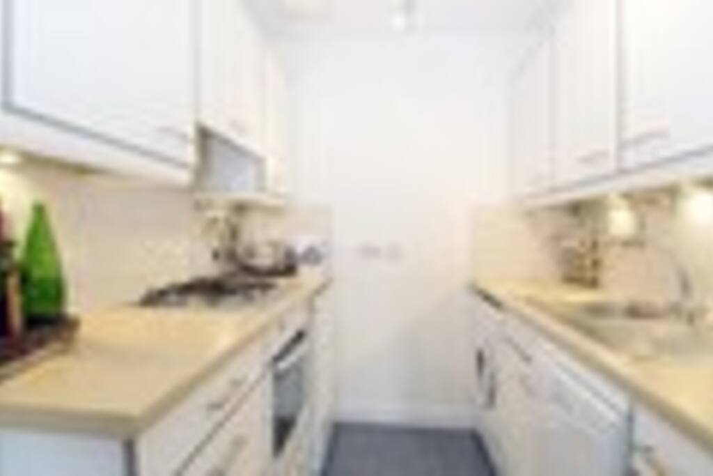Kitchen with dishwasher and washer/dryer
