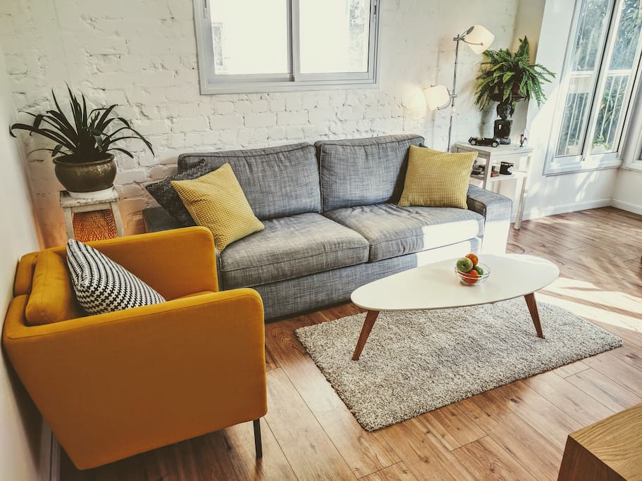 Living Room: Comfortable sofa and armchair