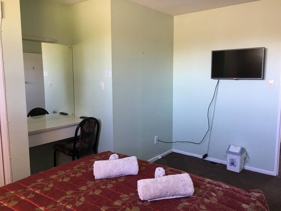 Tidy double room with TV and desk