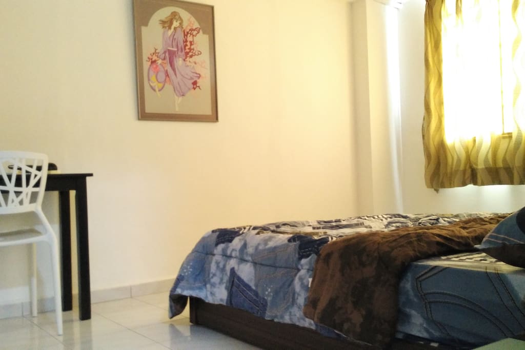 Cozy master bedroom with attached bathroom air-cond, ceiling fan, queen size bed, wardrobe, side table, console table & chair.