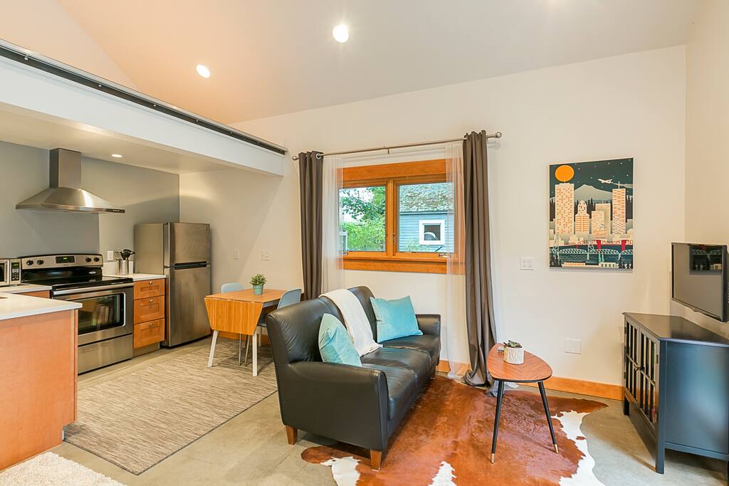 View of living room, dining area and kitchen.