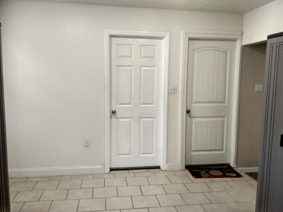Hall way to the bedroom with 2 doors