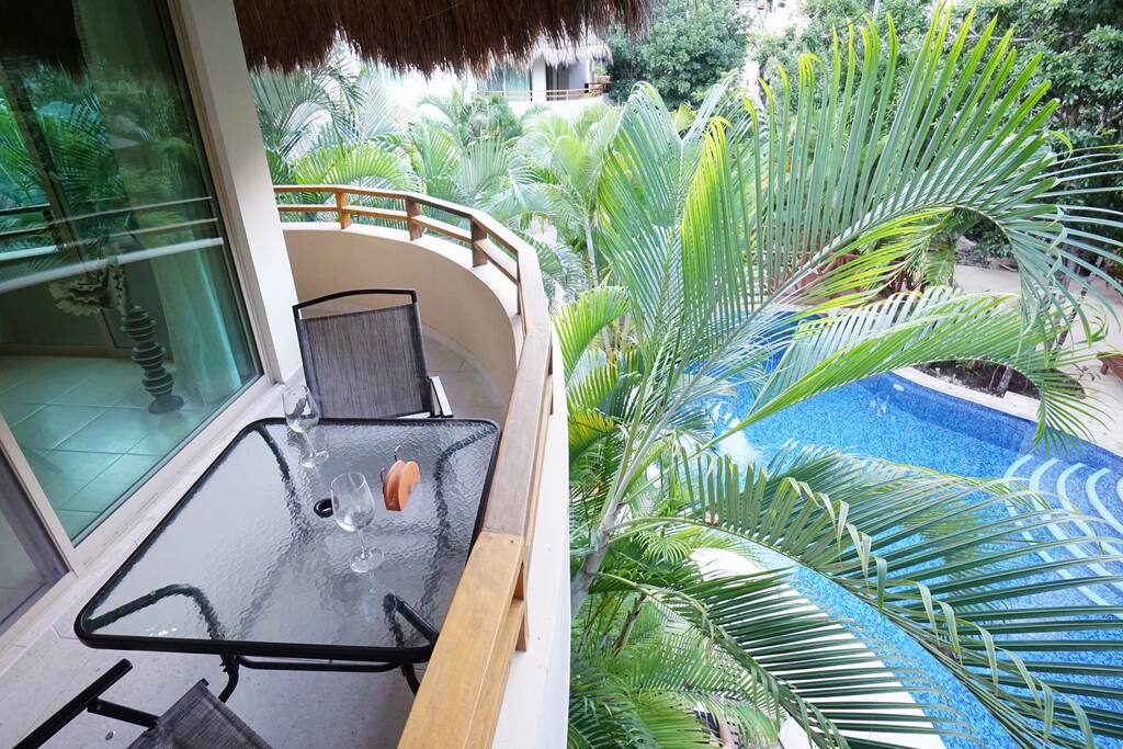 Get a glimpse of the pool and enjoy the view from the balcony