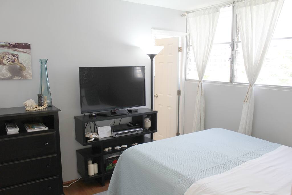 Guest bedroom with large TV equipped with cable!