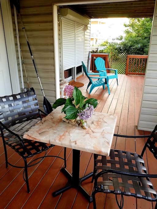 Private Back Deck with 2 entries to guest unit. One leads to the hallway, and one to the bedroom.