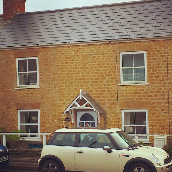 The front of the cottage with on-street parking