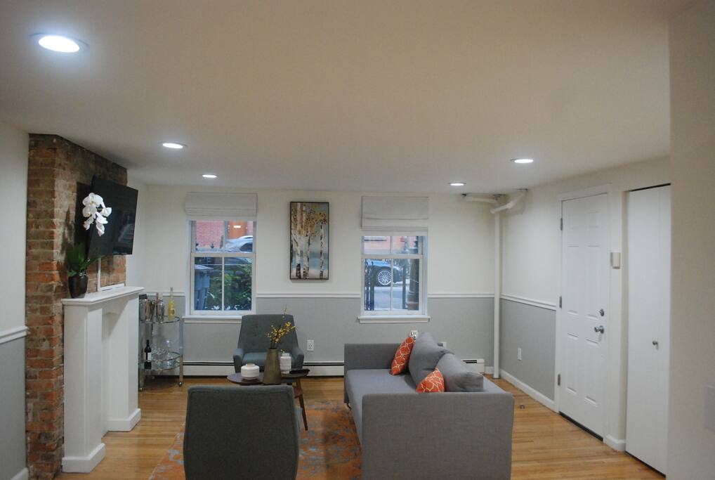 Comfy living room with loads of entertainment options and a sleek sleeper sofa