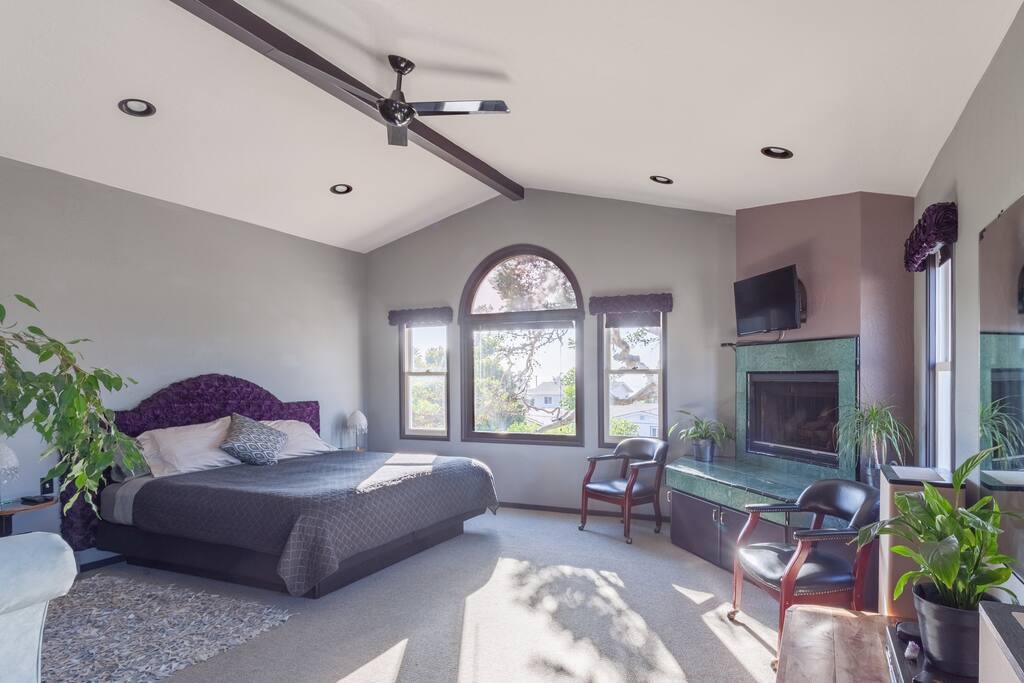 Gas fireplace and club chair seating.