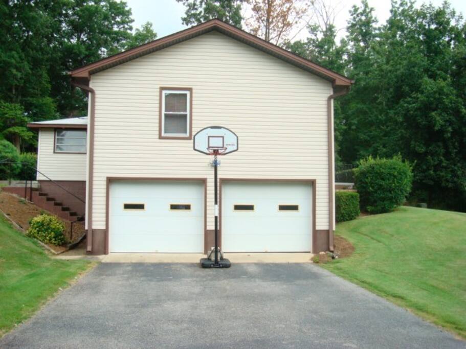 A garage for the car, ping pong table and basketball goal