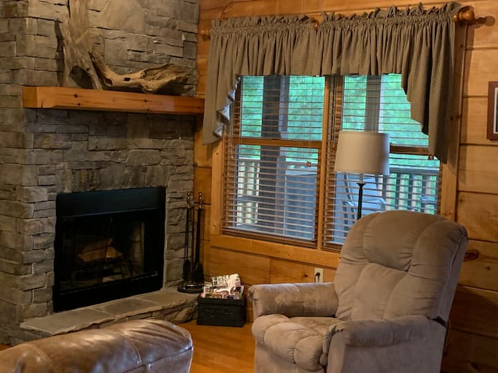 Living room with wood fireplace on main level