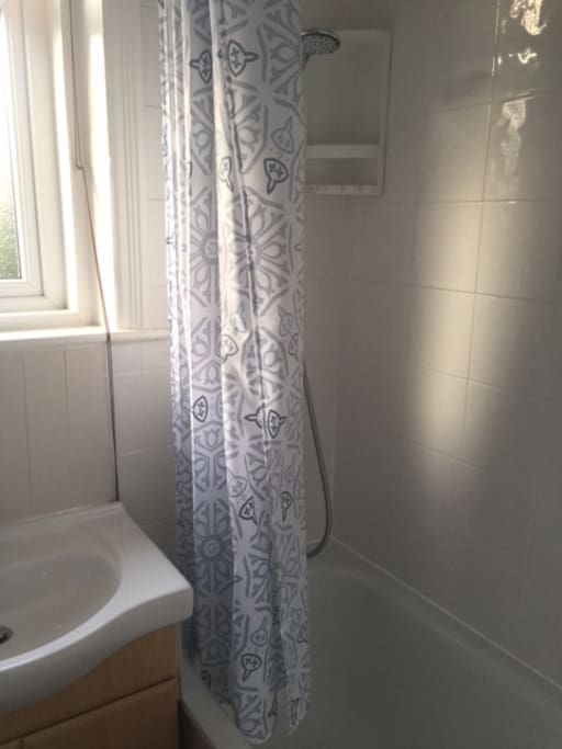 Separate bathroom just for you with bath and shower