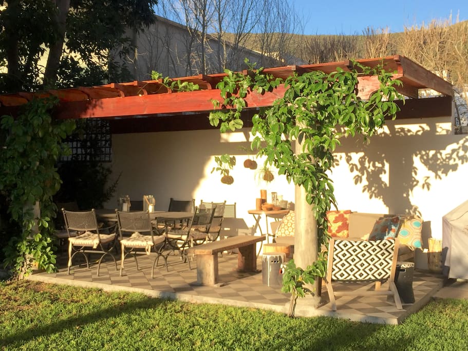 Undercover patio area for relaxing & eating with gorgeous granadilla vine.