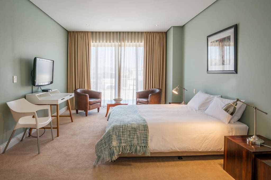 Upper Guest Bedroom with private reading area, TV and writing desk